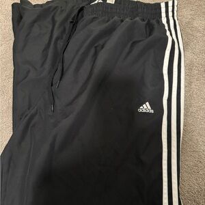Adidas 100% polyester track pant.